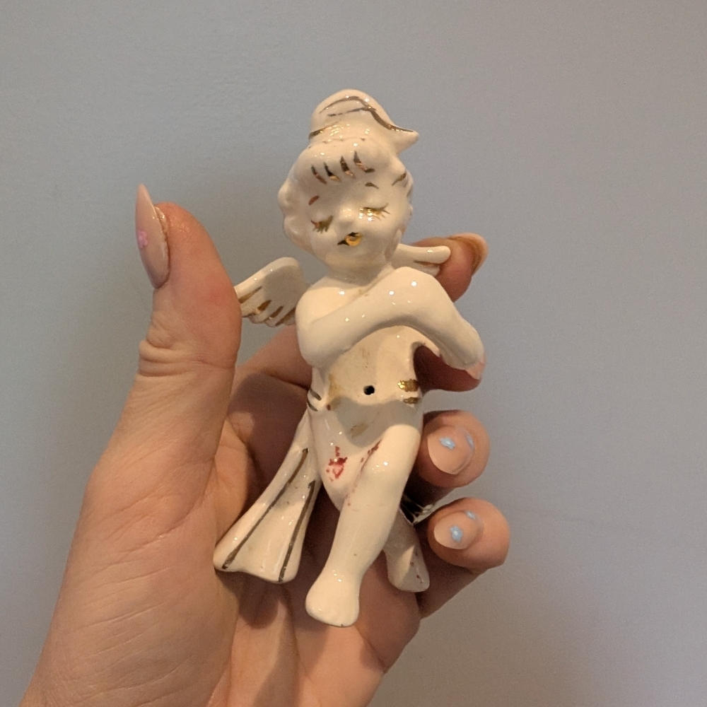 Ceramic Angel Figurine Holds A Candle